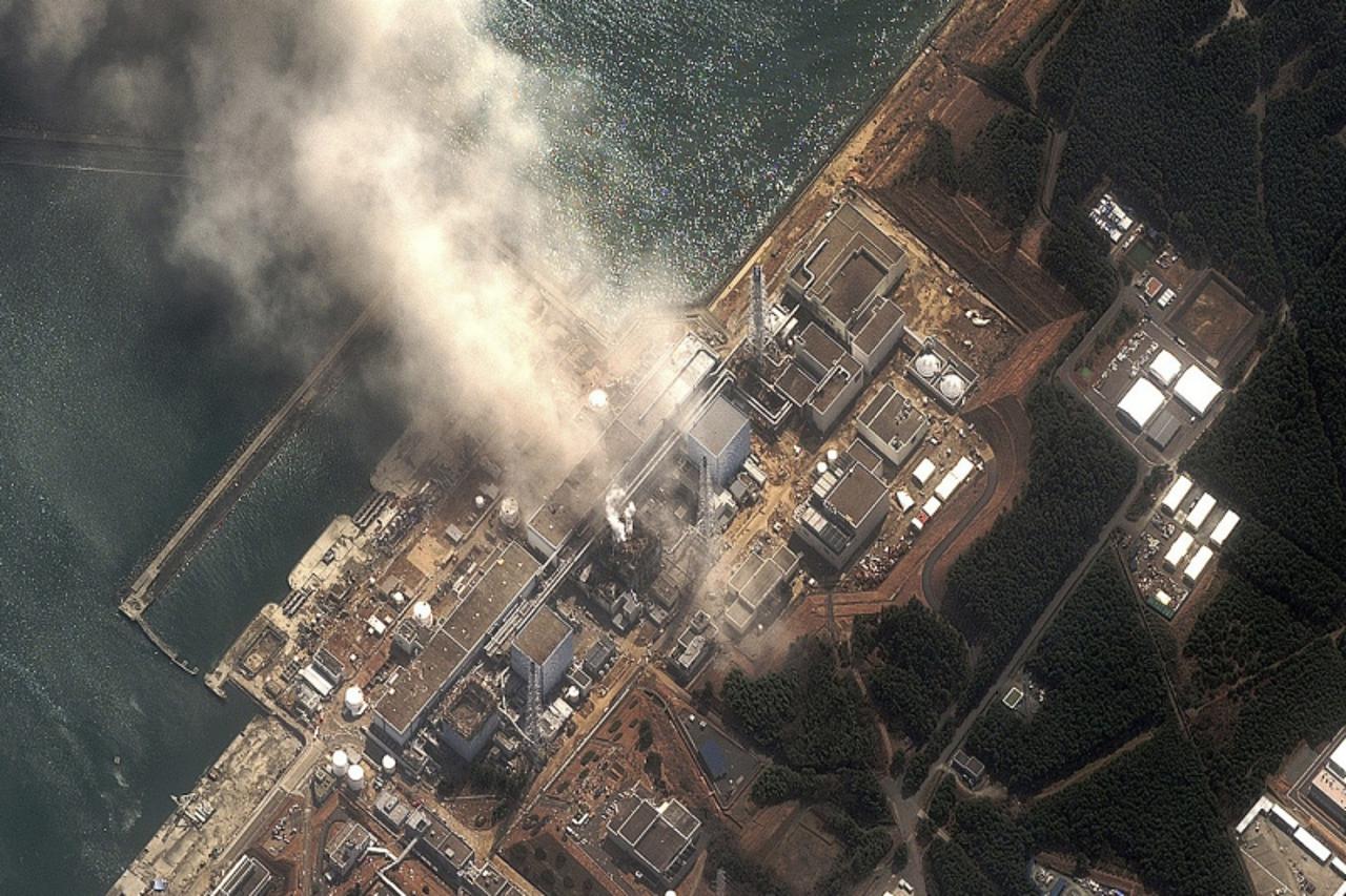 'The No.3 nuclear reactor of the Fukushima Daiichi nuclear plant is seen burning after a blast following an earthquake and tsunami in this handout satellite image taken March 14, 2011. The Fukushima n