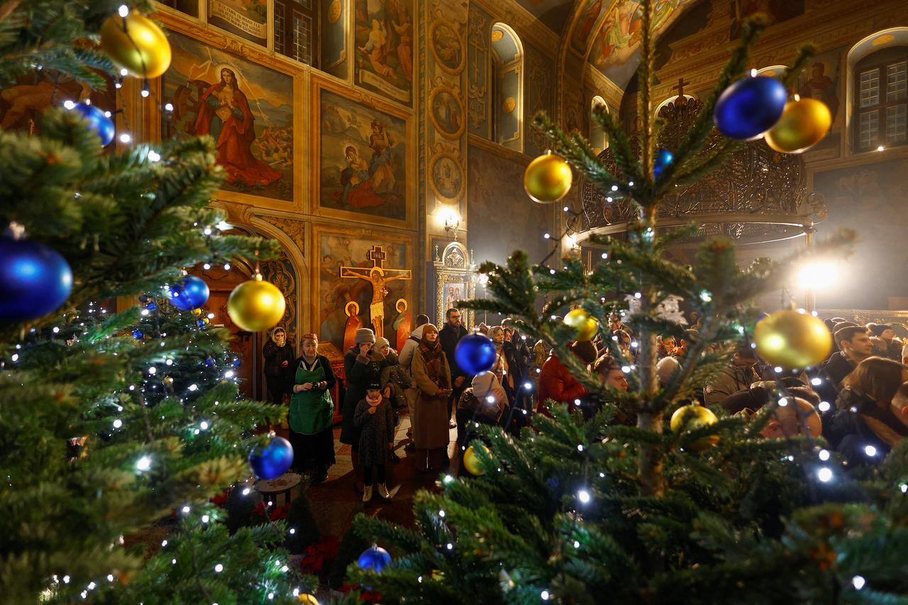 Ukrainian believers attend a Christmas Eve service in Kyiv