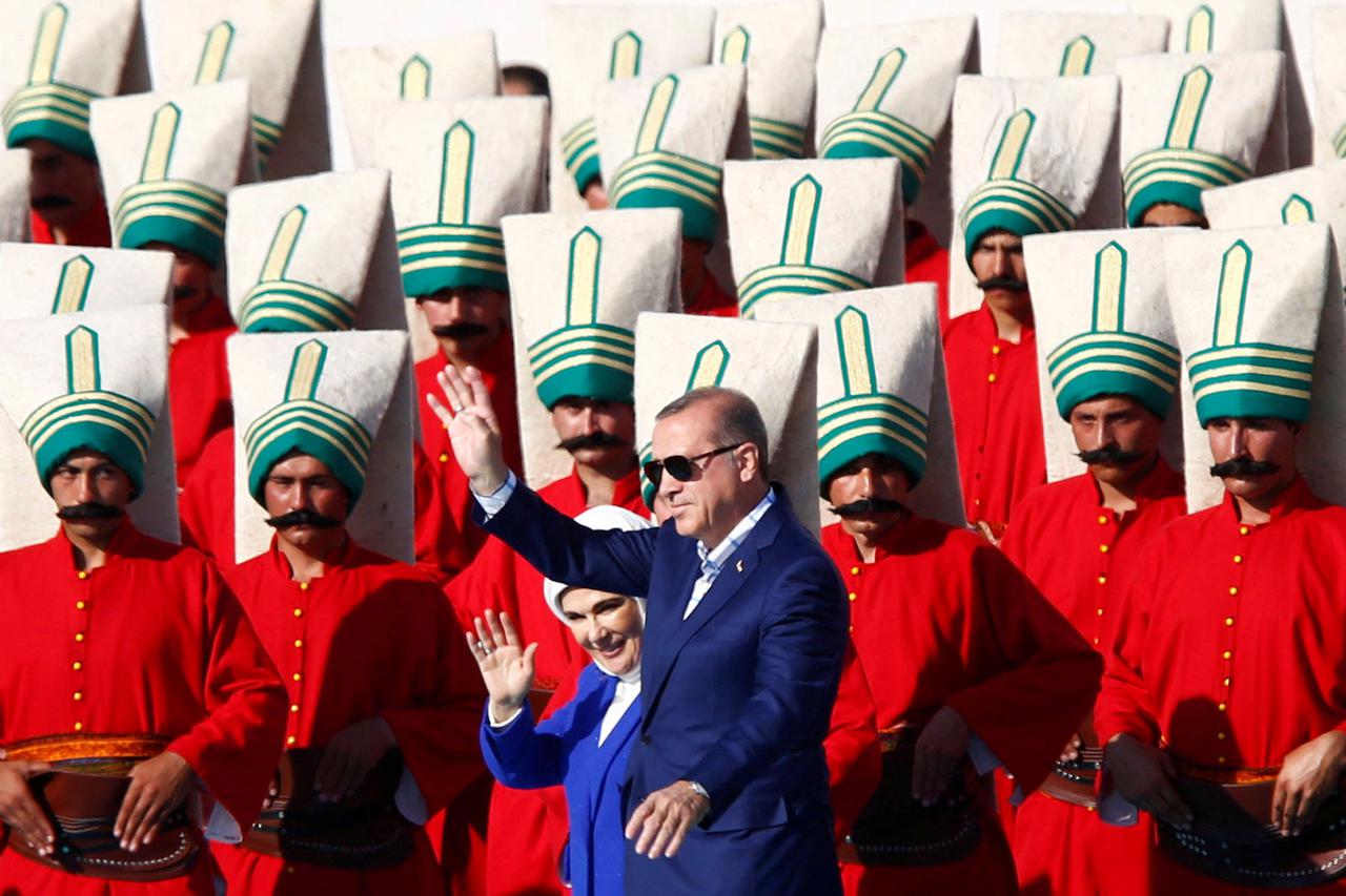 Turkish President Tayyip Erdogan, accompanied by his wife Emine Erdogan, greets supporters during a rally to mark the 563rd anniversary of the conquest of the city by Ottoman Turks, in Istanbul, Turkey, May 29, 2016. REUTERS/Murad Sezer     TPX IMAGES OF 