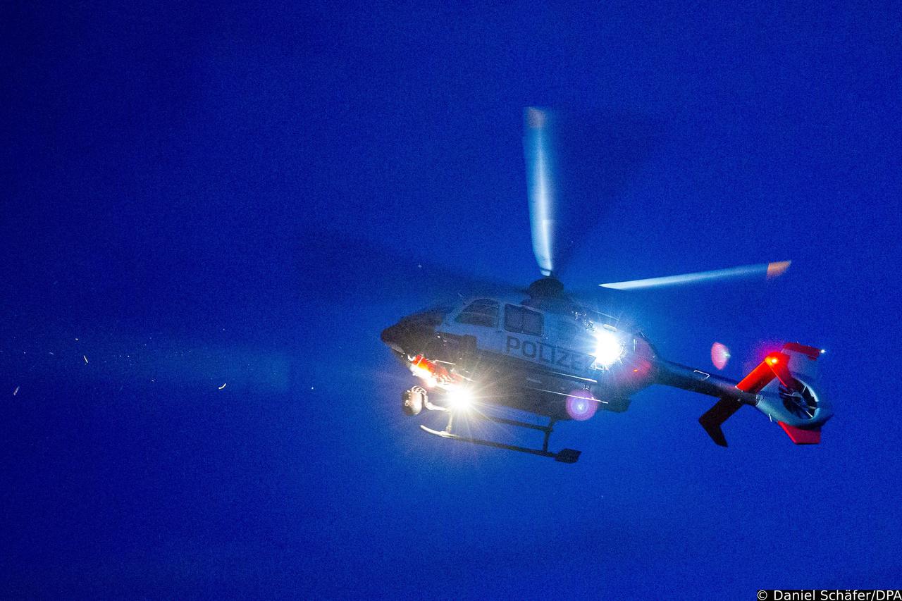 Police helicopter flies at night