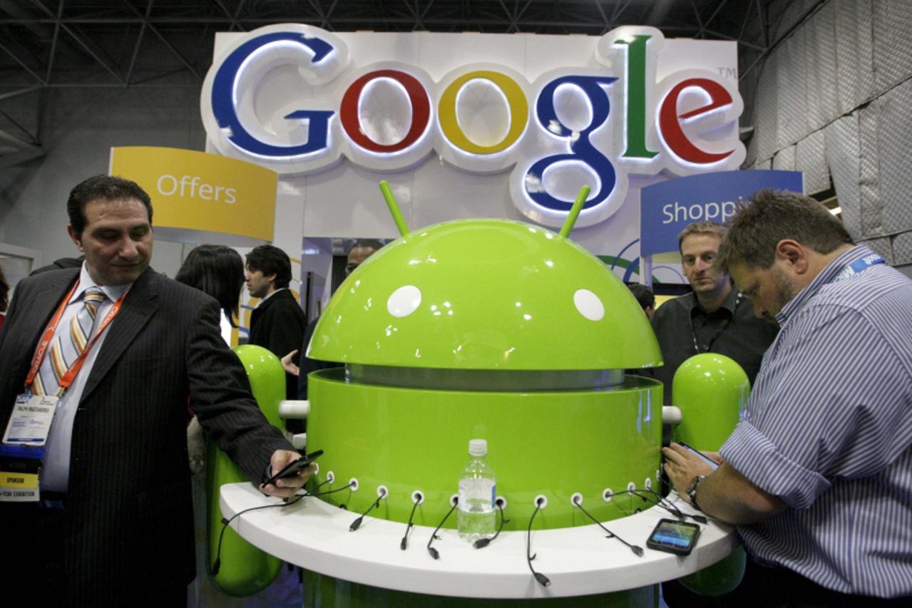 'People visit Google\'s stand at the National Retail Federation Annual Convention and Expo in New York January 16, 2012. REUTERS/ Kena Betancur (UNITED STATES - Tags: BUSINESS)'