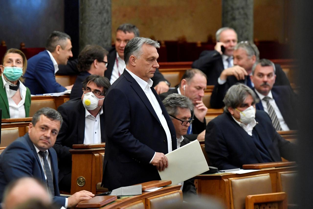 FILE PHOTO: Hungarian Prime Minister Viktor Orban arrives to attend the plenary session of the Parliament ahead of a vote to grant the government special powers to combat the coronavirus disease (COVID-19) crisis in Budapest