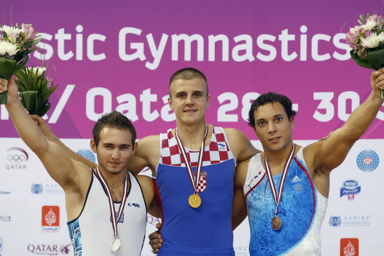 'Gold Medal winner Tomislav Markovic (C) of Croatia stands with silver medal winner Eleftherios Kosmidis (L) of Greece and bronze medal winner Thomas Bouhail of France following the men\'s floor durin