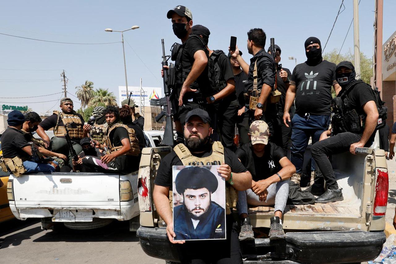 Followers of Iraqi cleric Moqtada al-Sadr withdraw from the streets after violent clashes, near the Green Zone in Baghdad