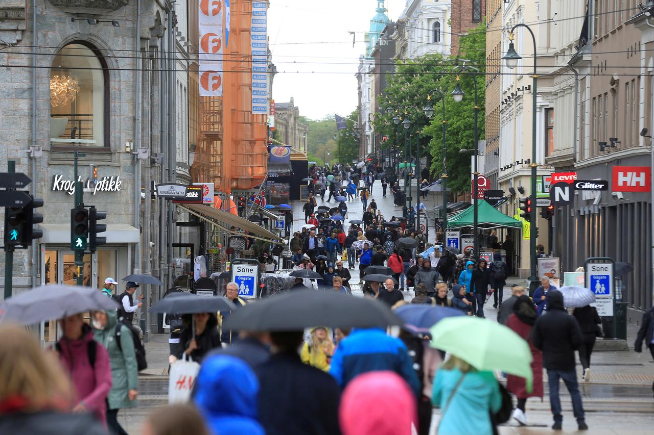 FILE PHOTO: People walk at Karl Johans street in Oslo