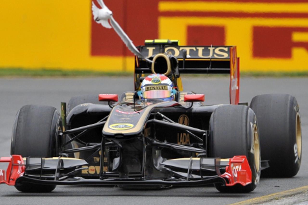 \'Lotus-Renault driver Vitaly Petrov of Russia races through a corner during the qualifying session for Formula One\'s Australian Grand Prix in Melbourne on March 26, 2011. The first race of the 2011 