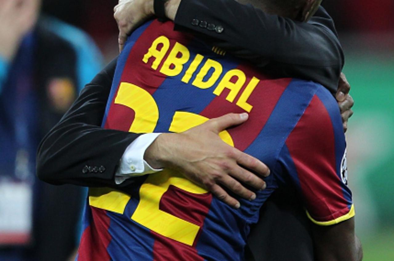 'Barcelona manager Josep Guardiola (left) celebrates with Eric Abidal after the final whistlePhoto: Press Association/PIXSELL'
