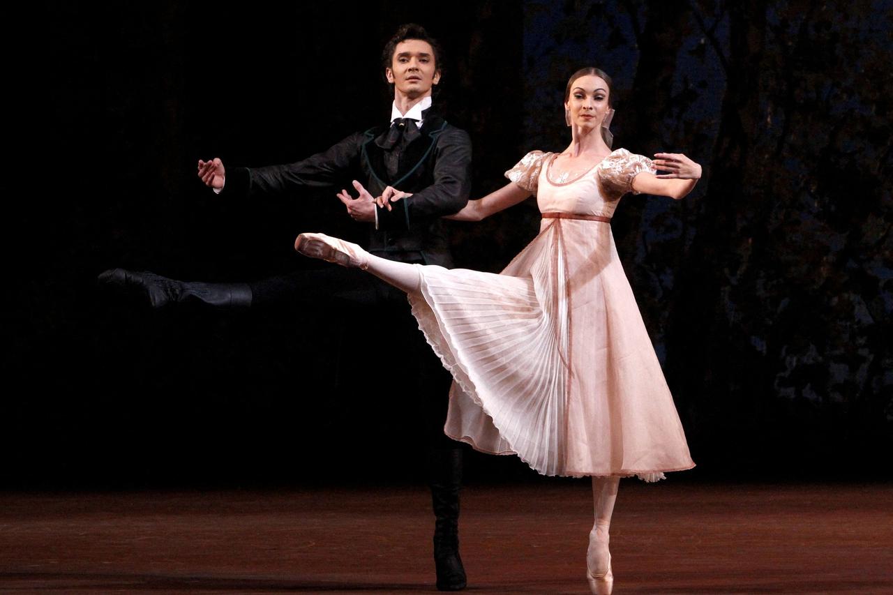 Dancers Olga Smirnova (R) in the role of Tatyana and Vladislav Lantratov in the role of Onegin perform during a media preview of the ballet 'Onegin' at the Bolshoi Theatre in Moscow