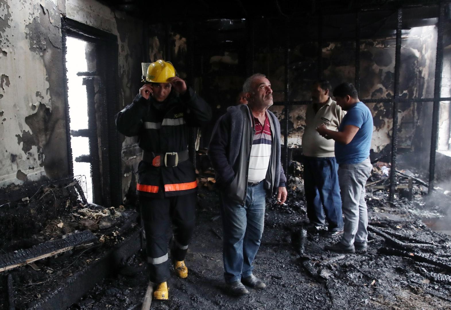 BARDA, AZERBAIJAN - OCTOBER 5, 2020: People examine a residential building damaged in a shelling attack. The situation in Nagorno-Karabakh escalated on September 27, 2020, with reports from Yerevan on the Azerbaijani troops advancing in the direction of Nagorno-Karabakh and shelling its settlements, including the capital city of Stepanakert. Both Azerbaijan and Armenia have declared martial law and military mobilization, reporting on casualties and injuries among civilians as well. Valery Sharifulin/TASS Photo via Newscom Newscom/PIXSELL