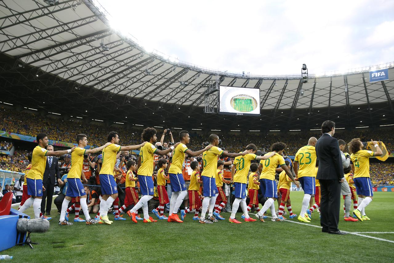 Football - Brazil v Germany - FIFA World Cup Brazil 2014 - Semi Final - Estadio Mineirao, Belo Horizonte, Brazil - 8/7/14 Brazil enter the pitch before the game Mandatory Credit: Action Images / Andrew Couldridge  EDITORIAL USE ONLY.