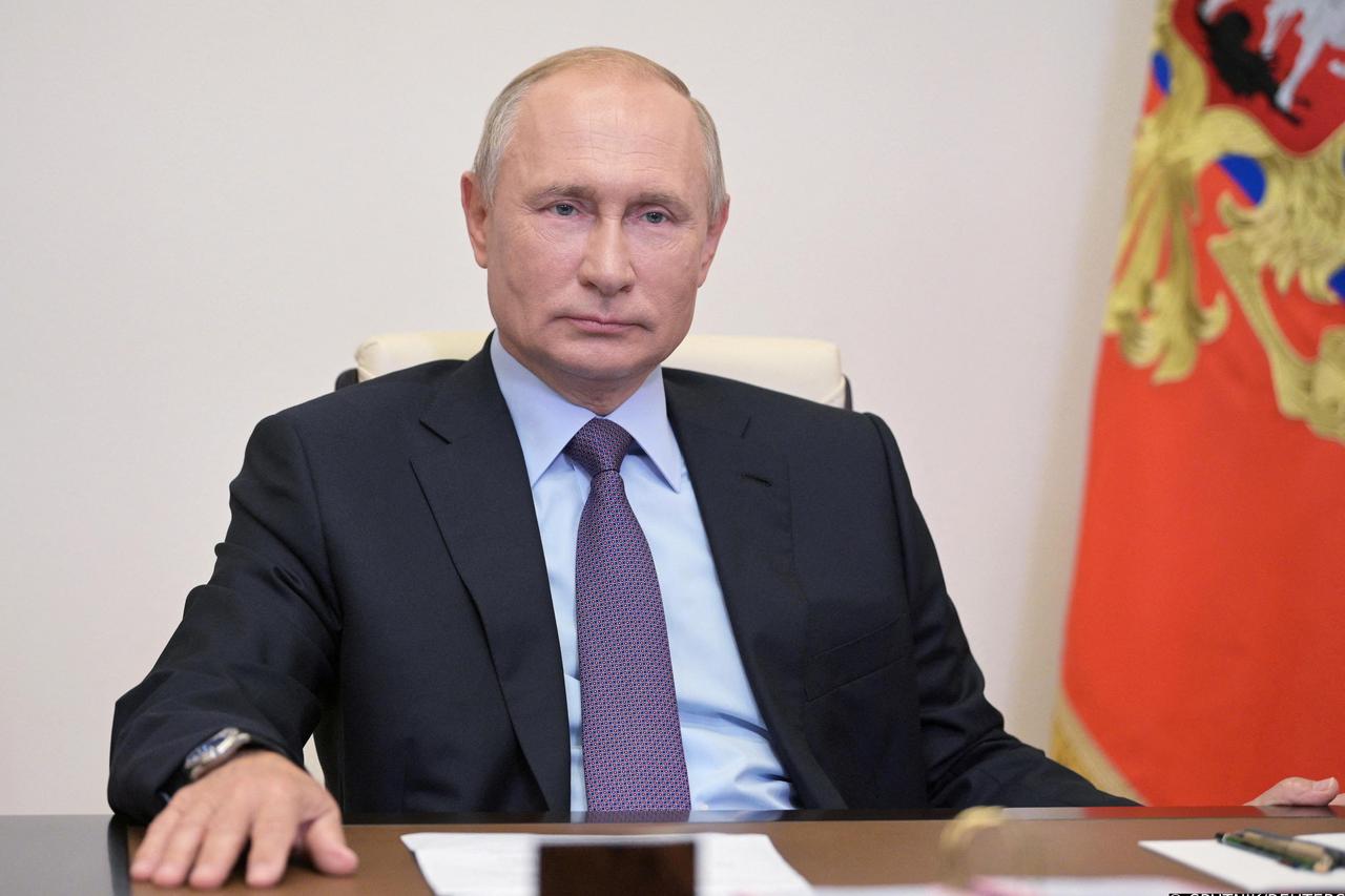 FILE PHOTO: Russia's President Putin attends the launching ceremony of the new Euro+ combined oil refining unit at the Gazprom Neft Moscow Refinery, via video link outside Moscow