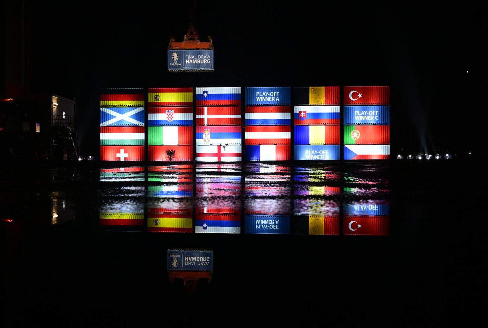 Soccer Football - Port workers in Hamburg stack containers with flags of the Euro 2024 teams in accordance with the Euro 2024 draw - Hamburg, Germany - December 2, 2023  General view of the final groups displayed on containers in Hamburg Port REUTERS/Fabian Bimmer Photo: Fabian Bimmer/REUTERS