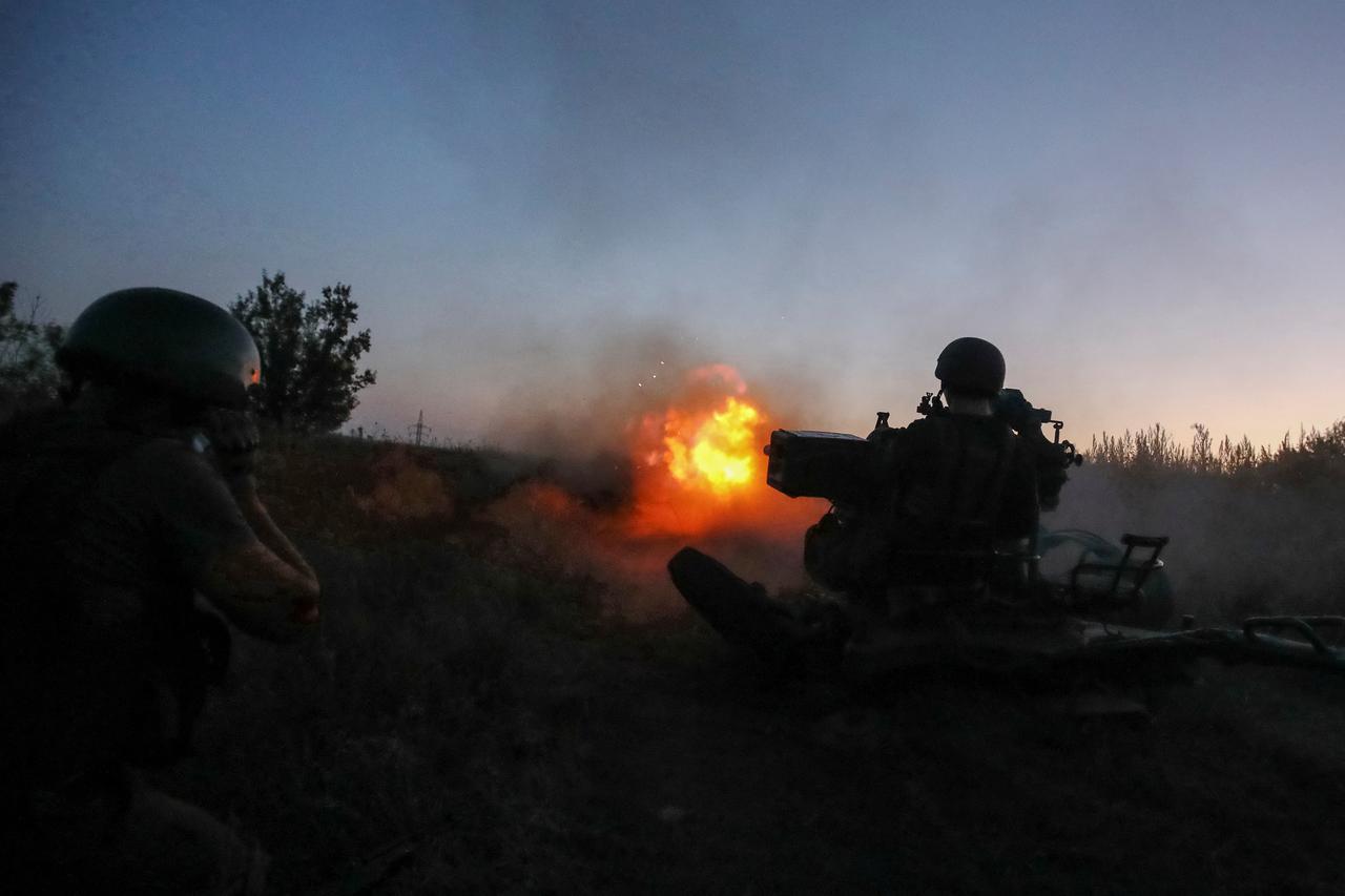 Ukrainian serviceman fires with a ZU-23-2 anti-aircraft cannon at position near a front line in Kharkiv region