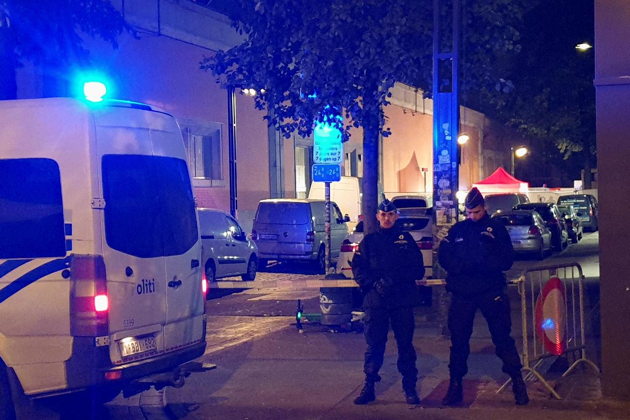 Belgian police officers keep guard after an attack in which a police officer was killed, in Brussels