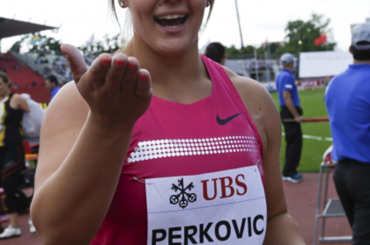 'Sandra Perkovic of Croatia reacts after winning in the Discus event of the Lausanne Diamond League meeting in Lausanne, July 4, 2013.  REUTERS/Denis Balibouse (SWITZERLAND  - Tags: SPORT ATHLETICS)'