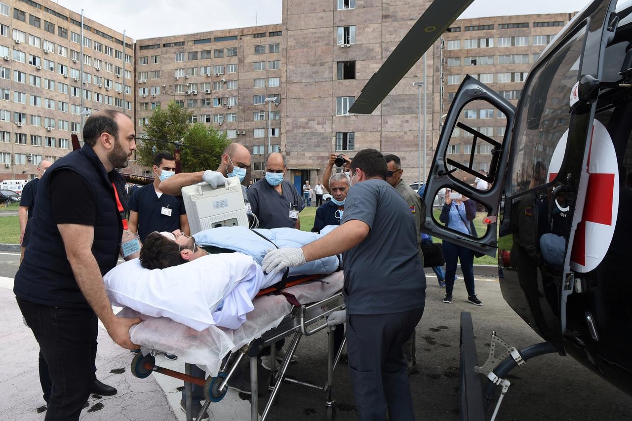 French journalist Rafael Yaghobzadeh, who was wounded during the shelling in Nagorno-Karabakh, is carried into a helicopter for transportation to Zvartnots Airport in Yerevan