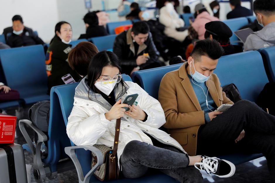 Travellers at Wuhan Tianhe International Airport