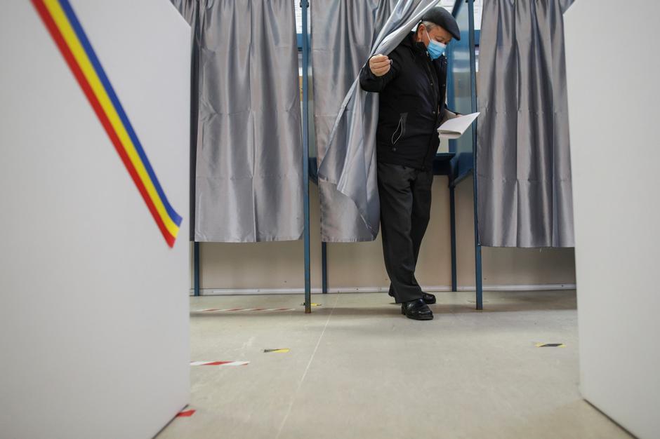 A man casts his ballot in Romania's legislative election