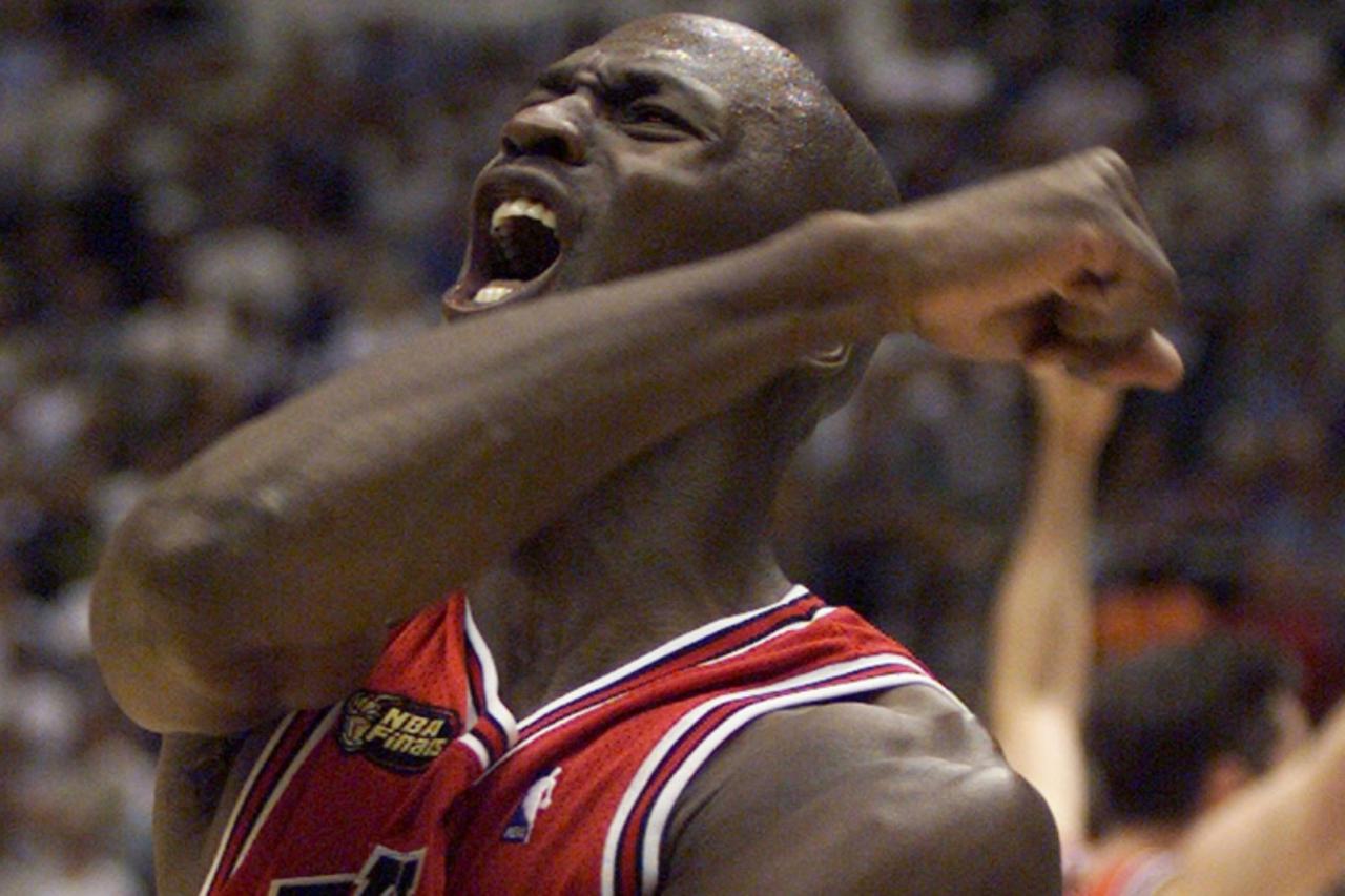 'Chicago Bulls\' Michael Jordan celebrates after the Bulls defeated the Utah Jazz in Game 6 of the NBA finals to win their sixth championship in Salt Lake City, in this June 14, 1998 file photo. Jorda