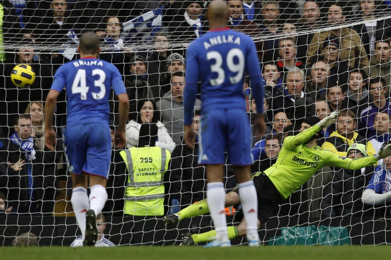 \'Aston Villa\'s Ashley Young (not pictured) scores a penalty against Chelsea\'s goalkeeper Petr Cech (R) during their English Premier League soccer match at Stamford Bridge in London January 2, 2011.