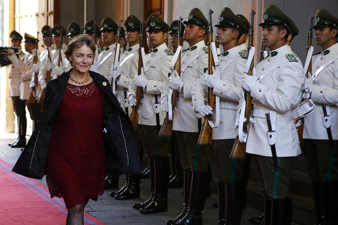 Croatia's First Deputy Prime Minister and Minister of Foreign and European Affairs Vesna Pusic walks past an honor guard before a meeting with Chile's President Michelle Bachelet (not pictured) at the government palace in Santiago, February 27, 2015. Pusi