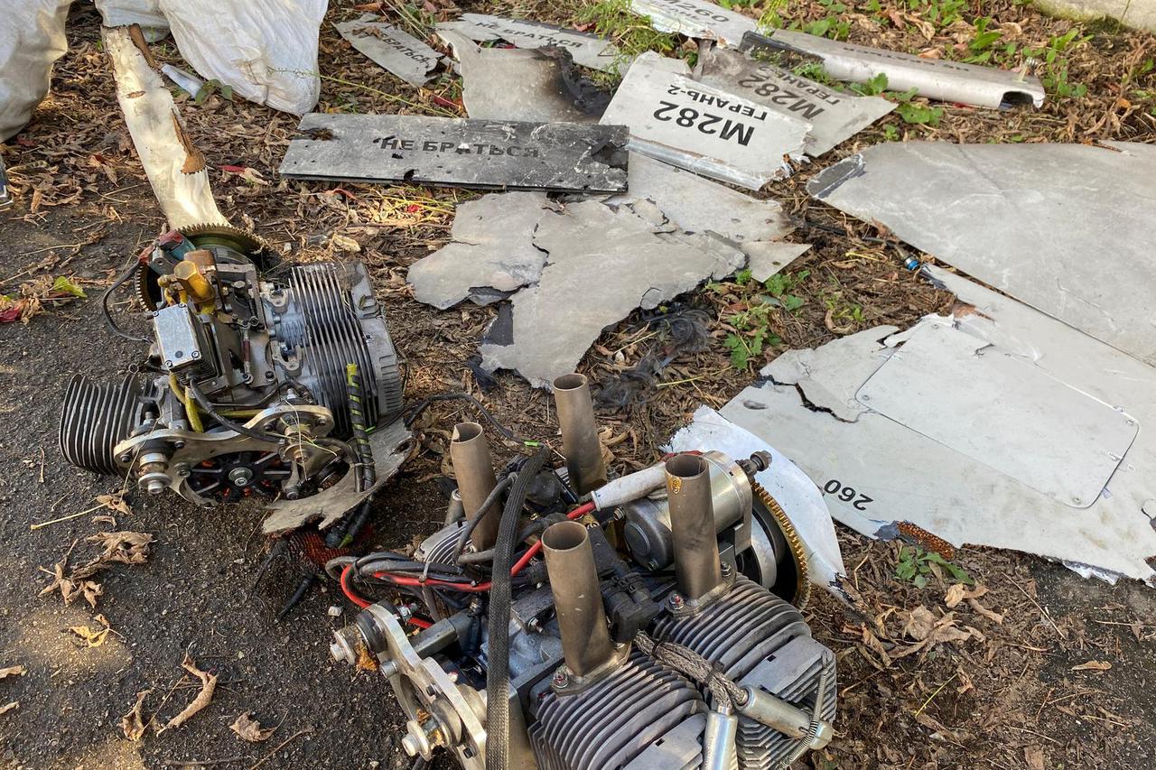 Parts of an unmanned aerial vehicle, what Ukrainian authorities consider to be an Iranian made suicide drone Shahed-136 are seen at a site of Russian strike in Kharkiv