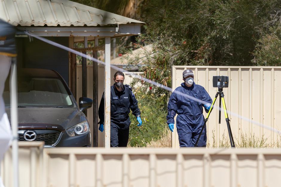 Forensic police officers work at the house where missing girl Cleo Smith was rescued, in Carnarvon