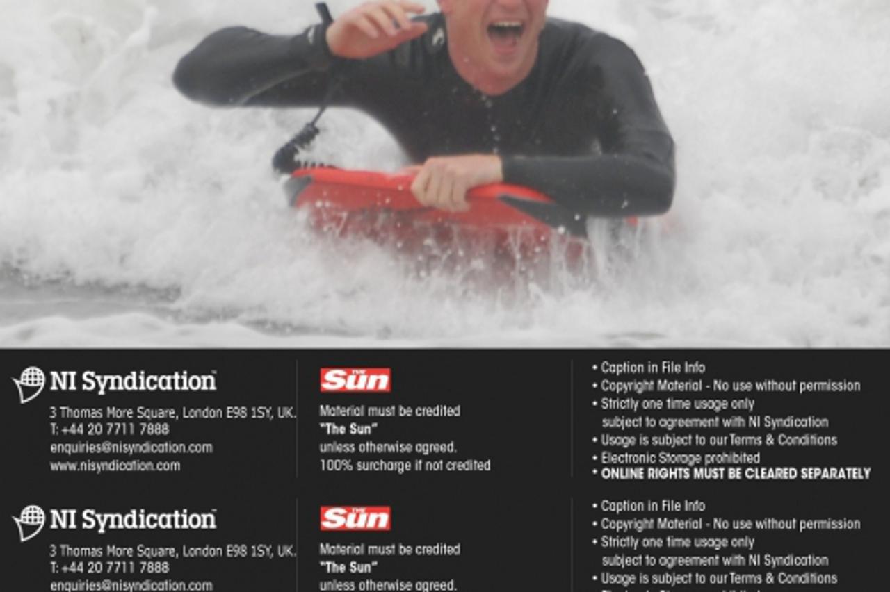 'Prince William and Prince Harry surfing on public beach Polzeath. north Cornwall on Jul 7. Pix via Marc Giddings. Copyright The Sun/NI Syndication Online use must be cleared separately'