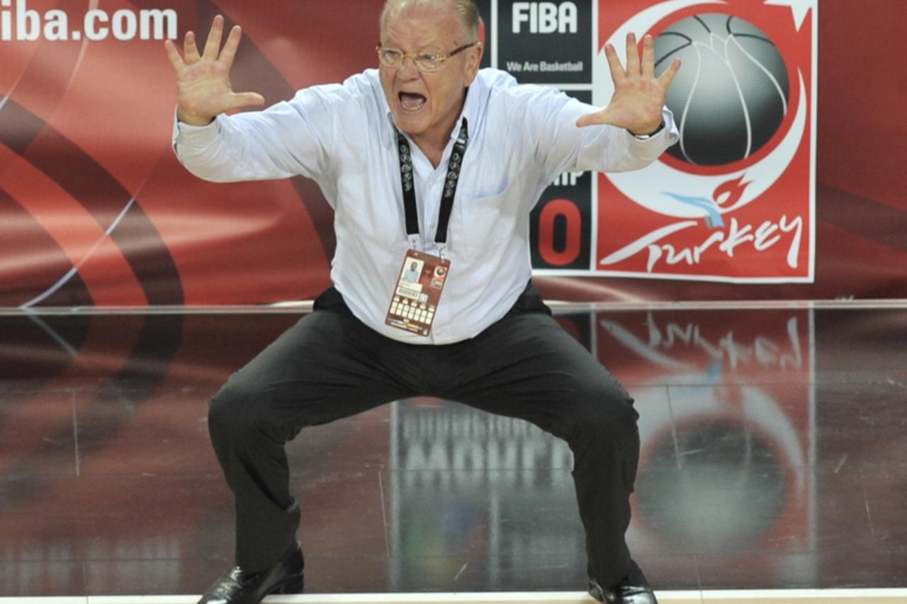 'Serbia\'s head coach Dusan Ivkovic reacts to play during a World Cup Championship quarter final basketball match Serbia versus Spain in Istanbul on September 8, 2010. AFP PHOTO / ARIS MESSINIS'
