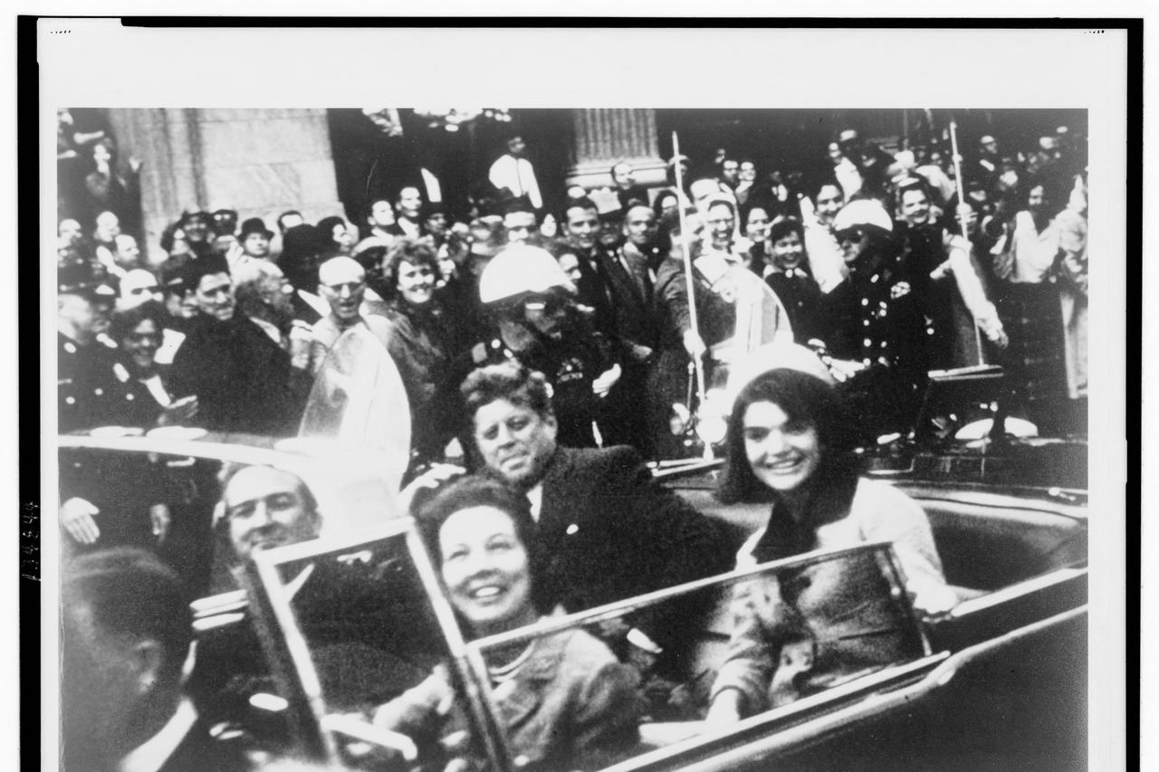 FILE PHOTO: File handout image shows former U.S. President Kennedy and first lady Jacqueline Kennedy riding in motorcade in Dallas