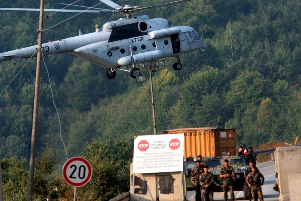 \'French KFOR soldiers guard the border crossing between Serbia and northern Kosovo at Brnjak on September 16, 2011.   Kosovo and EU police were deployed at two disputed border crossings with Serbia i