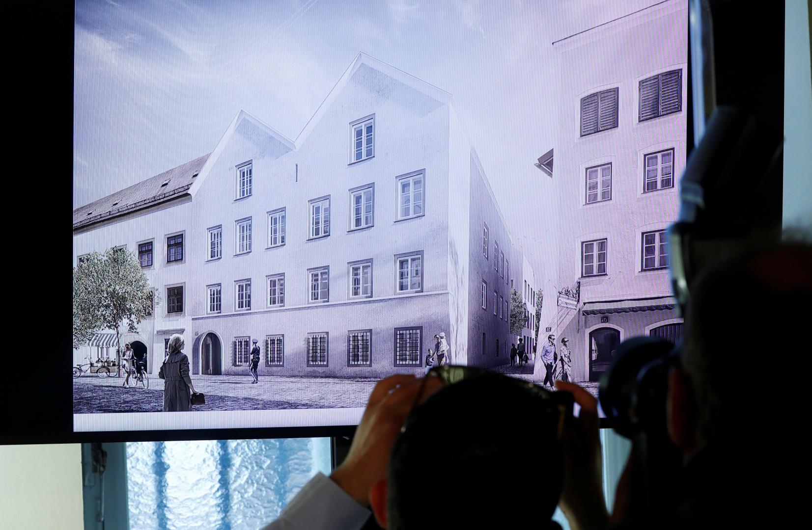 Austria presents redesign plan for house Hitler was born in, in Vienna Photographers take pictures of a tv screen showing the plan chosen for an architectural redesign of the house Adolf Hitler was born in during a news conference in Vienna, Austria June 2, 2020.  REUTERS/Leonhard Foeger LEONHARD FOEGER