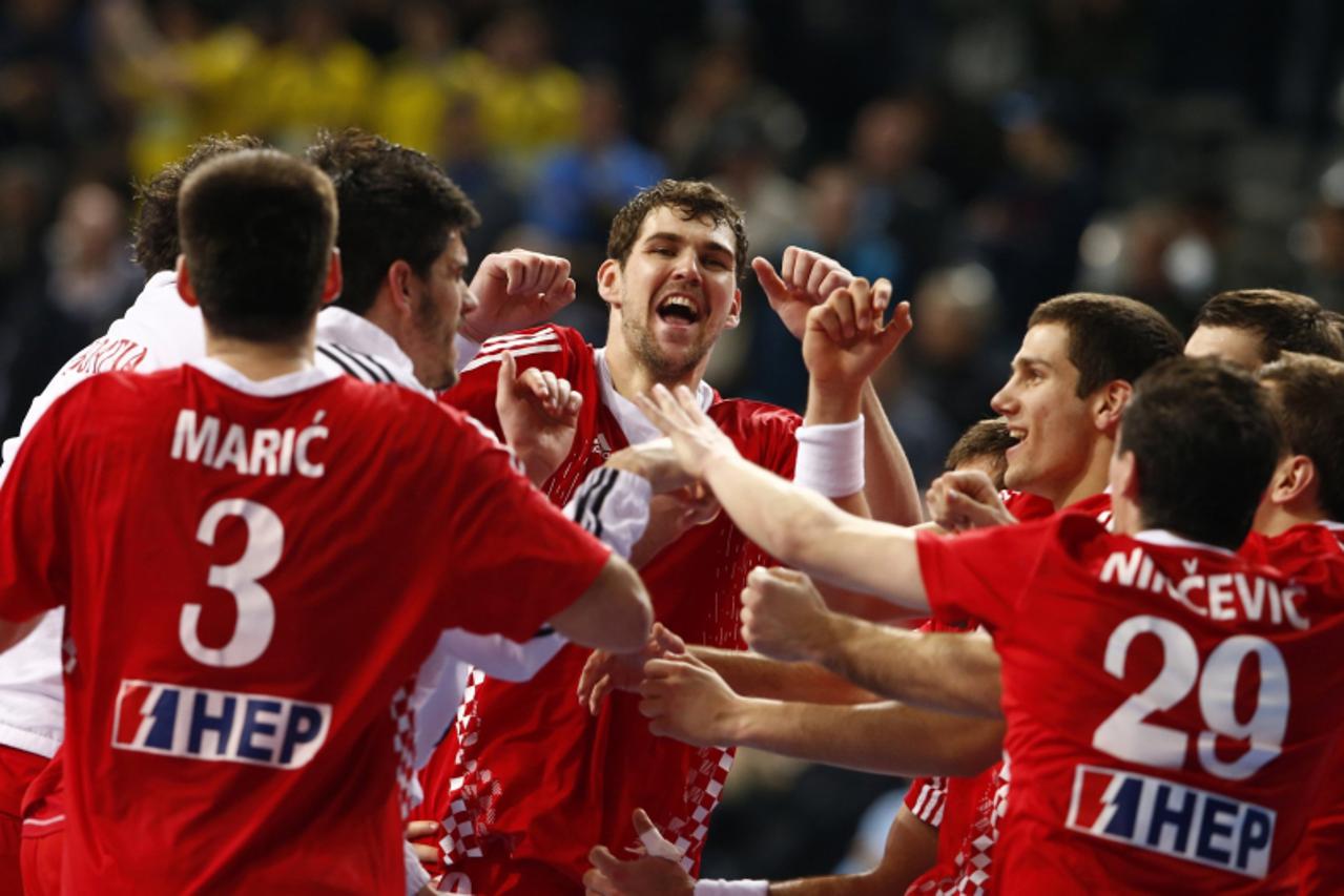 'Croatia\'s players celebrate their victory over Slovenia after their Men\'s Handball World Championship third-place match at the Palau Sant Jordi arena in Barcelona January 26, 2013. REUTERS/Marko Dj