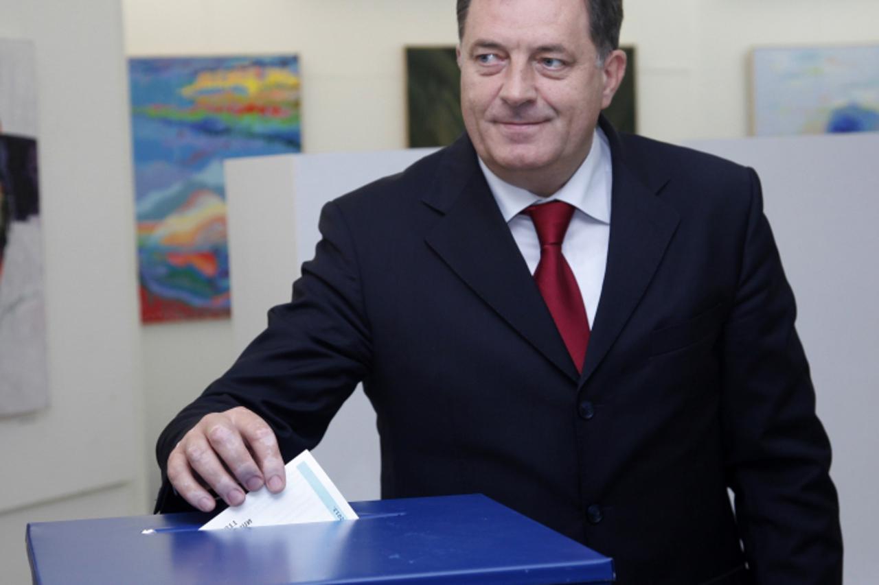 'Bosnian politician, Milorad Dodik casts his vote for local authorities, in the Western-Bosnian town of Banja Luka, on October 7, 2012.  Polling stations opened throughout Bosnia on Sunday for a munic