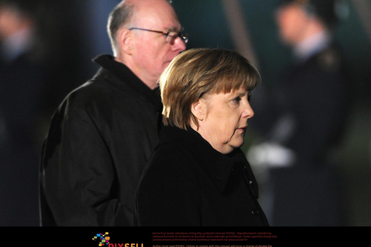 'German Chancellor Angela Merkel (CDU, R) and President of the Bundestag Norbert Lammert arrive for the Grand Tattoo (Großer Zapfenstreich) for former German President Christian Wulff in front of Bell