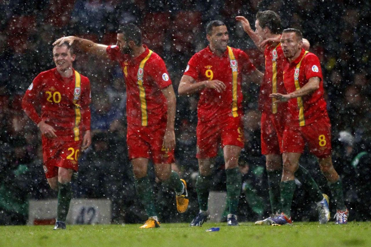 'Wales' Hal Robson-Kanu (3rd R) celebrates with his team mates after scoring a penalty kick against Scotland during their 2014 World Cup qualifying soccer match at Hampden Park stadium in Glasgow, Sc