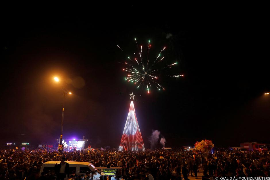 People gather before the New Year celebrations in Mosul