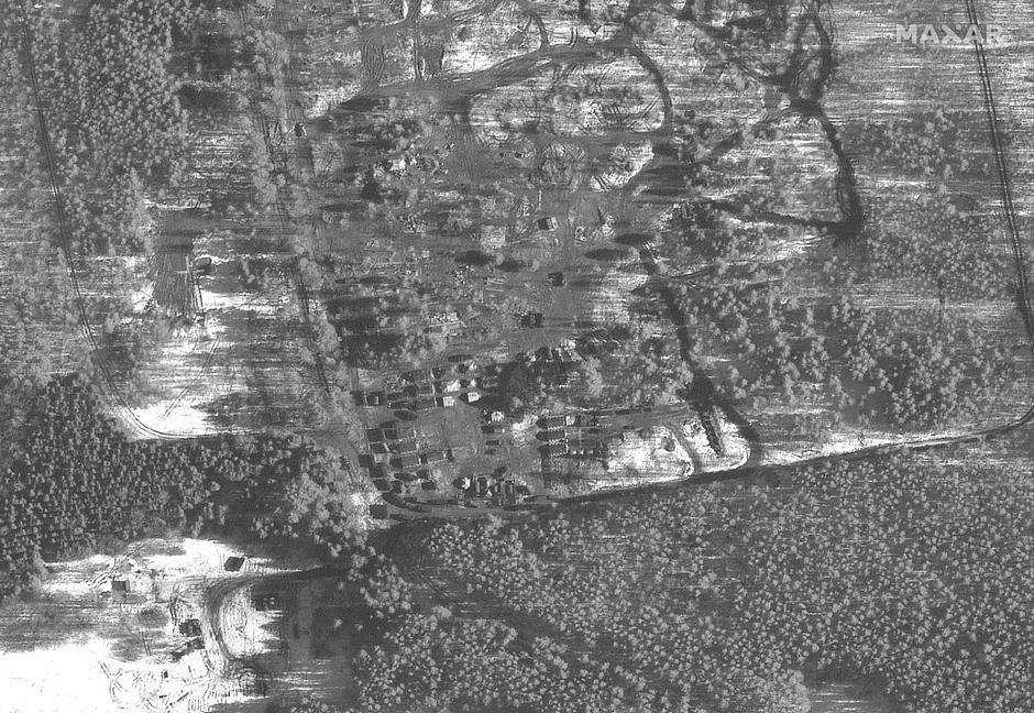A satellite image shows troop tents and a housing area, in Pochep