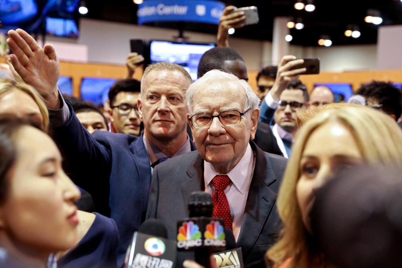 FILE PHOTO: Berkshire Hathaway Chairman Warren Buffett walks through the exhibit hall as shareholders gather to hear from the billionaire investor at Berkshire Hathaway Inc's annual shareholder meeting in Omaha