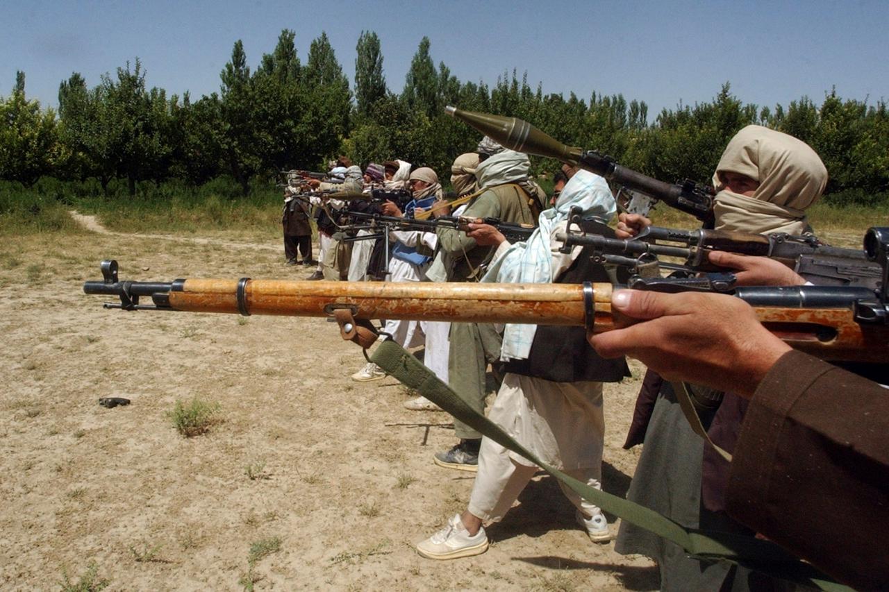 FILE PHOTO: Taliban fighters train with their weapons in an undisclosed location in Afghanistan