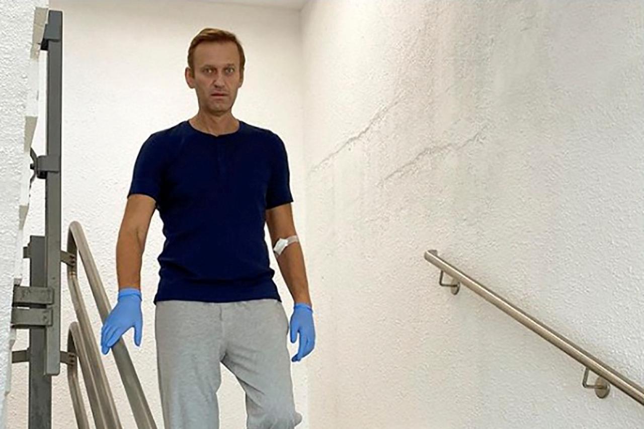FILE PHOTO: Russian opposition politician Alexei Navalny goes downstairs at Charite hospital in Berlin