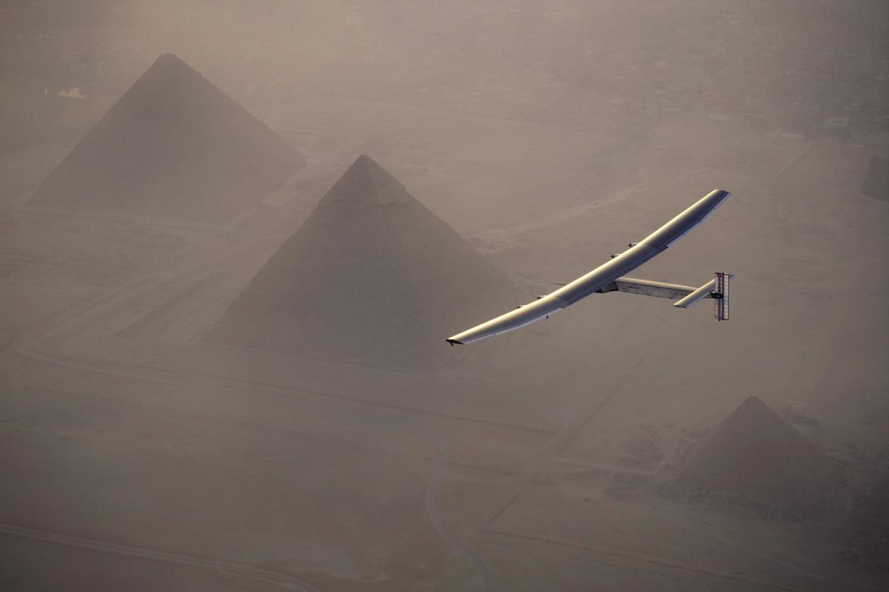 Solar Impulse 2, the solar powered plane, piloted by Swiss pioneer Andre Borschberg is seen during the flyover of the pyramids of Giza on July 13, 2016 prior to the landing in Cairo, Egypt in this photo released on July 13, 2016. Jean Revillard/SI2/Handou