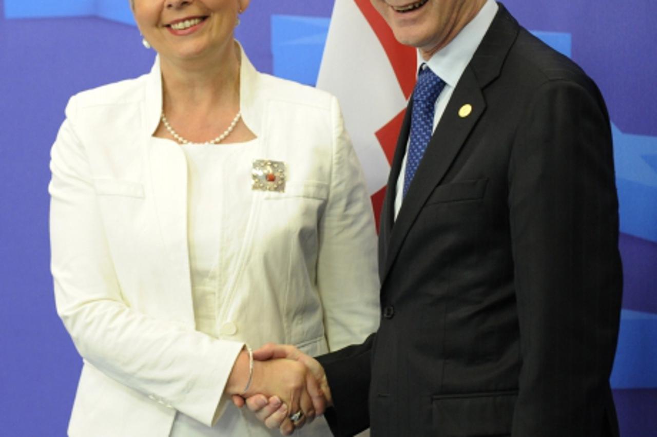 'European Council President Herman Van Rompuy and Croatian Prime Minister Jadranka Kosor pose at the end of a summit of the EU heads of State, on June 24, 2011 in Brussels. European Union leaders gave