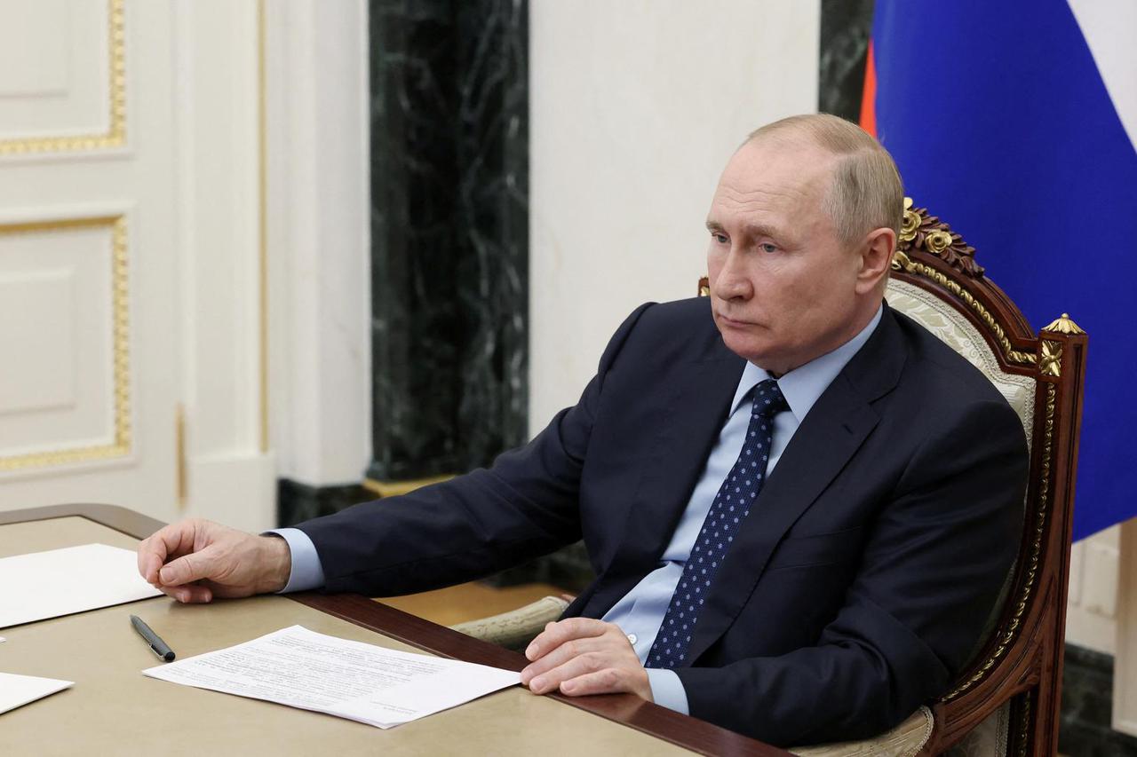 Russian President Vladimir Putin chairs a meeting with members of the government via video link in Moscow