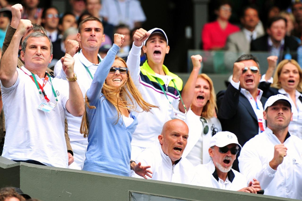 'Jelena Ristic (in blue), partner  of Serbian player Novak Djokovic reacts durring the semi final between Serbian player Novak Djokovic and French player Jo-Wilfried Tsonga at the Wimbledon Tennis Cha