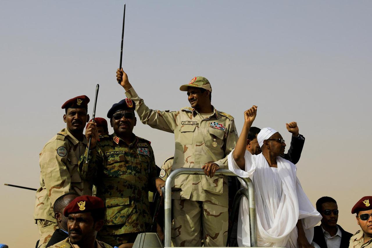 FILE PHOTO: Lieutenant General Mohamed Hamdan Dagalo greets his supporters as he arrives at a meeting in Aprag village