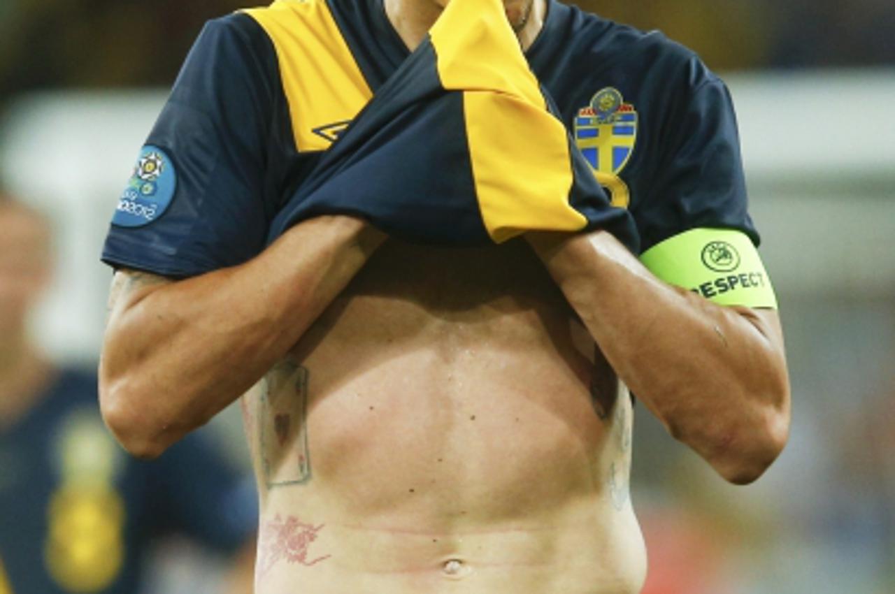 'Sweden\'s Zlatan Ibrahimovic reacts after losing their Group D Euro 2012 soccer match against Ukraine at the Olympic stadium in Kiev, June 11, 2012.              REUTERS/Eddie Keogh (UKRAINE  - Tags: