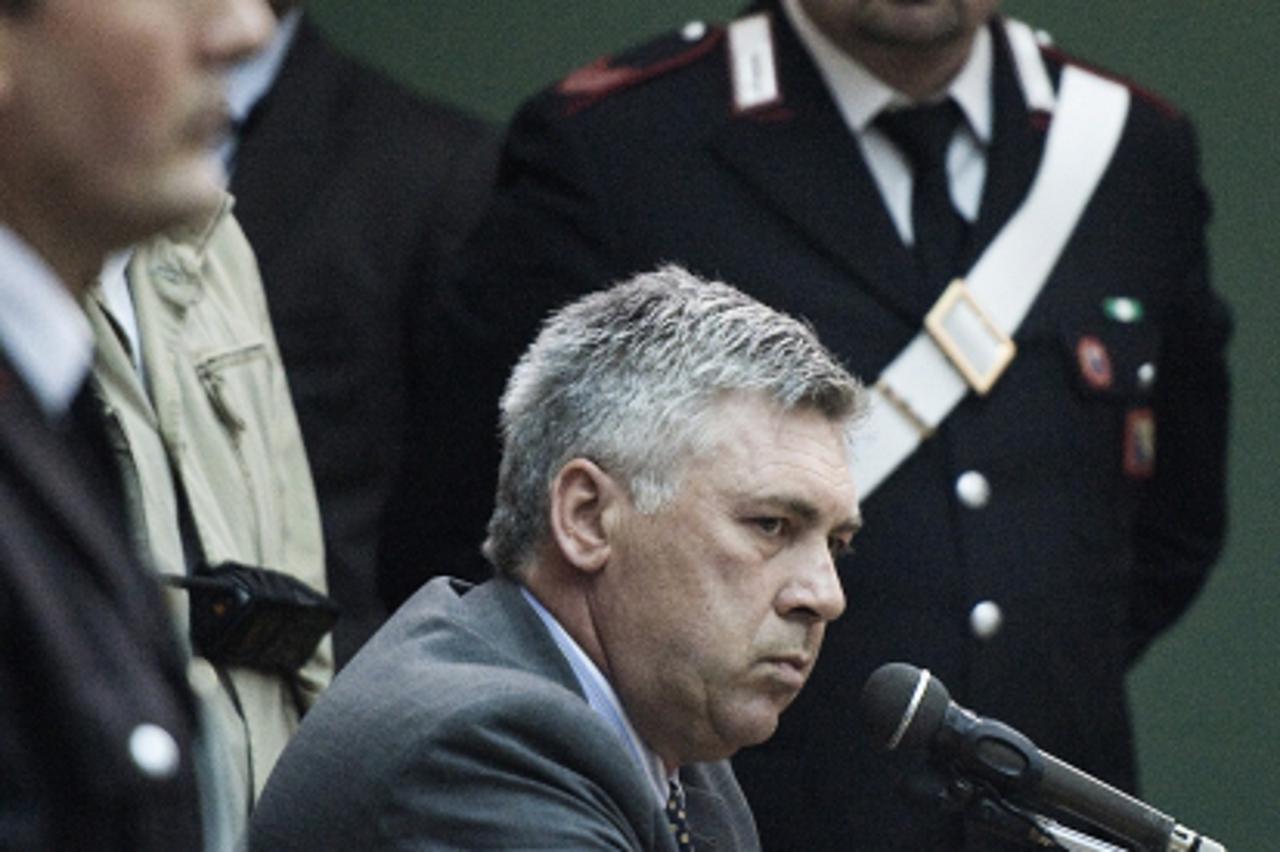 'Chelsea Football Club manager Carlo Ancelotti (C, down) attends a hearing in the Calciopoli trial in the Palace of Justice of Naples on May 11, 2010. The inquest, led by FIGC prosecutor Stefano Palaz