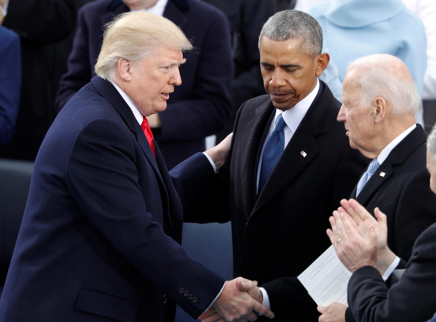 FILE PHOTO: U.S. President Donald Trump greets former Vice President Joe Biden and former President Barack Obama after being sworn in as president of the United States at U.S. Capitol in Washington FILE PHOTO: U.S. President Donald Trump greets former Vice President Joe Biden and former President Barack Obama after being sworn in as the 45th president of the United States on the West front of the U.S. Capitol in Washington, U.S., January 20, 2017.   REUTERS/Lucy Nicholson/File Photo Lucy Nicholson