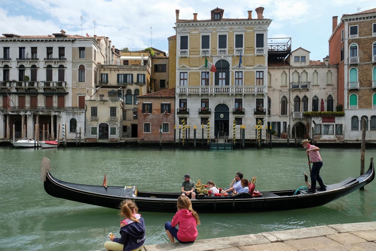 Gondoliers officially resume work for the first time following the country's strict coronavirus disease (COVID-19) lockdown in Venice
